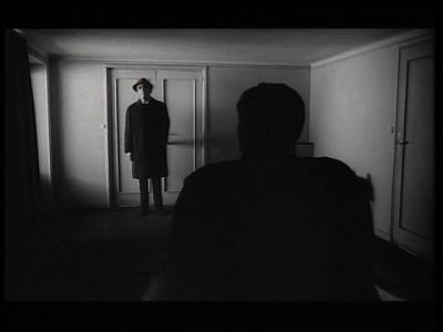 The Trial - man blocking door